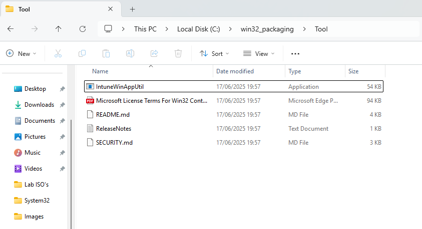 Screenshot of Windows File Explorer showing IntuneWinAppUtil.exe extracted into the tool folder inside win32_packaging directory.